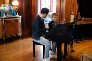 student playing piano at his concert